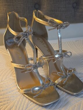 Unisa Gold T-Strap Bow Heel Sandals